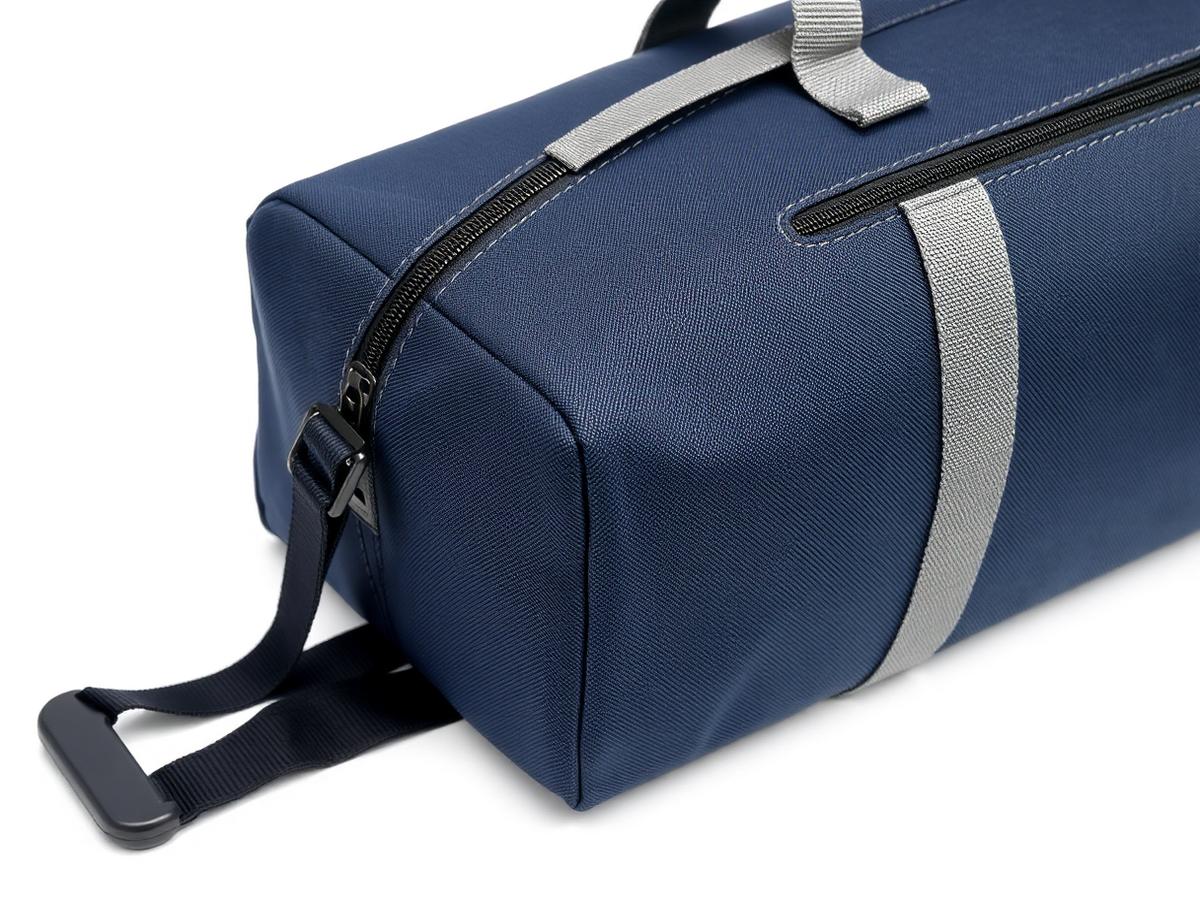 Detail of a navy technical fabric travel bag with webbing and zipper construction